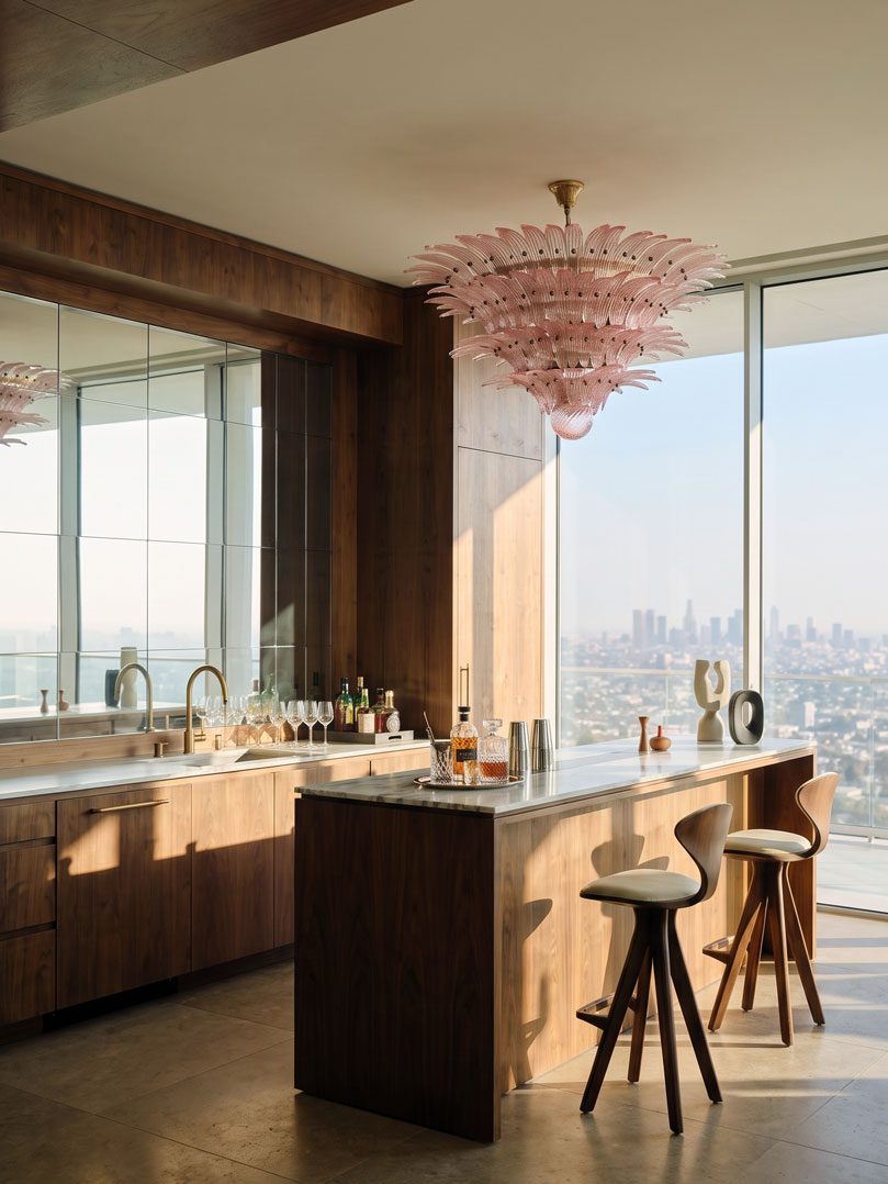 Pink Murano palmette chandelier hanging in bar.