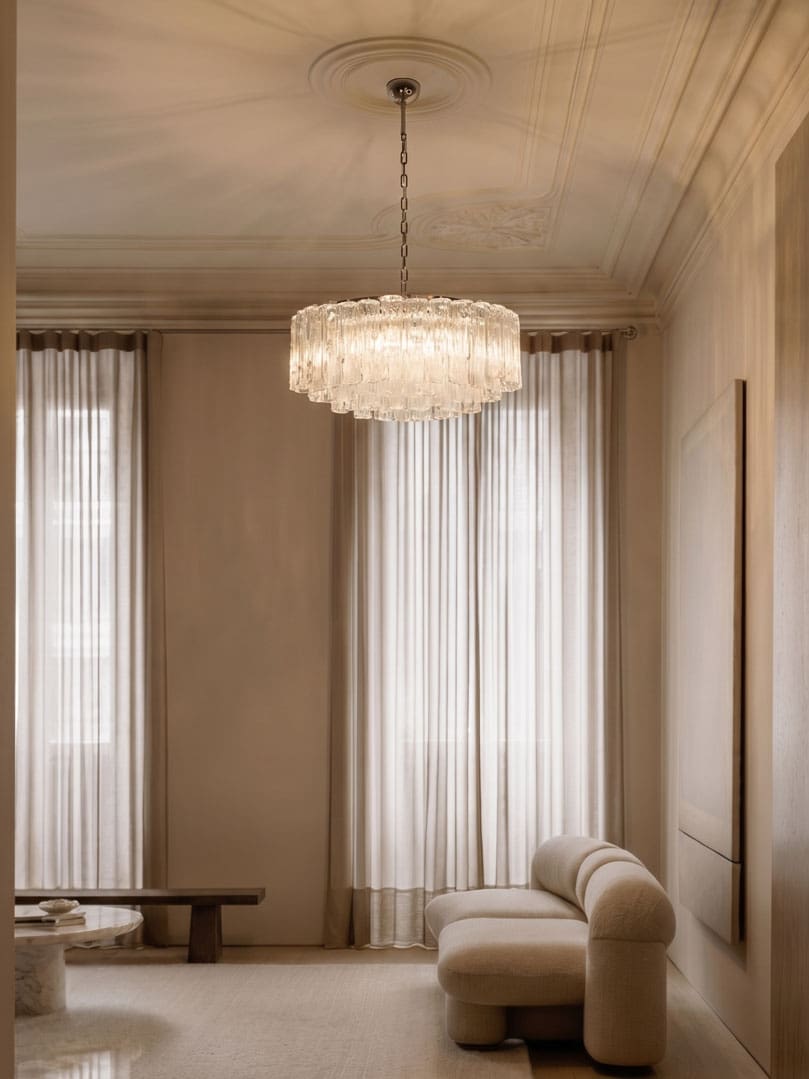 101 textured transparent Murano glass tube chandelier hanging in a livingroom