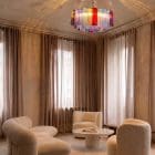 101 multi tube Murano chandelier hanging in livingroom.